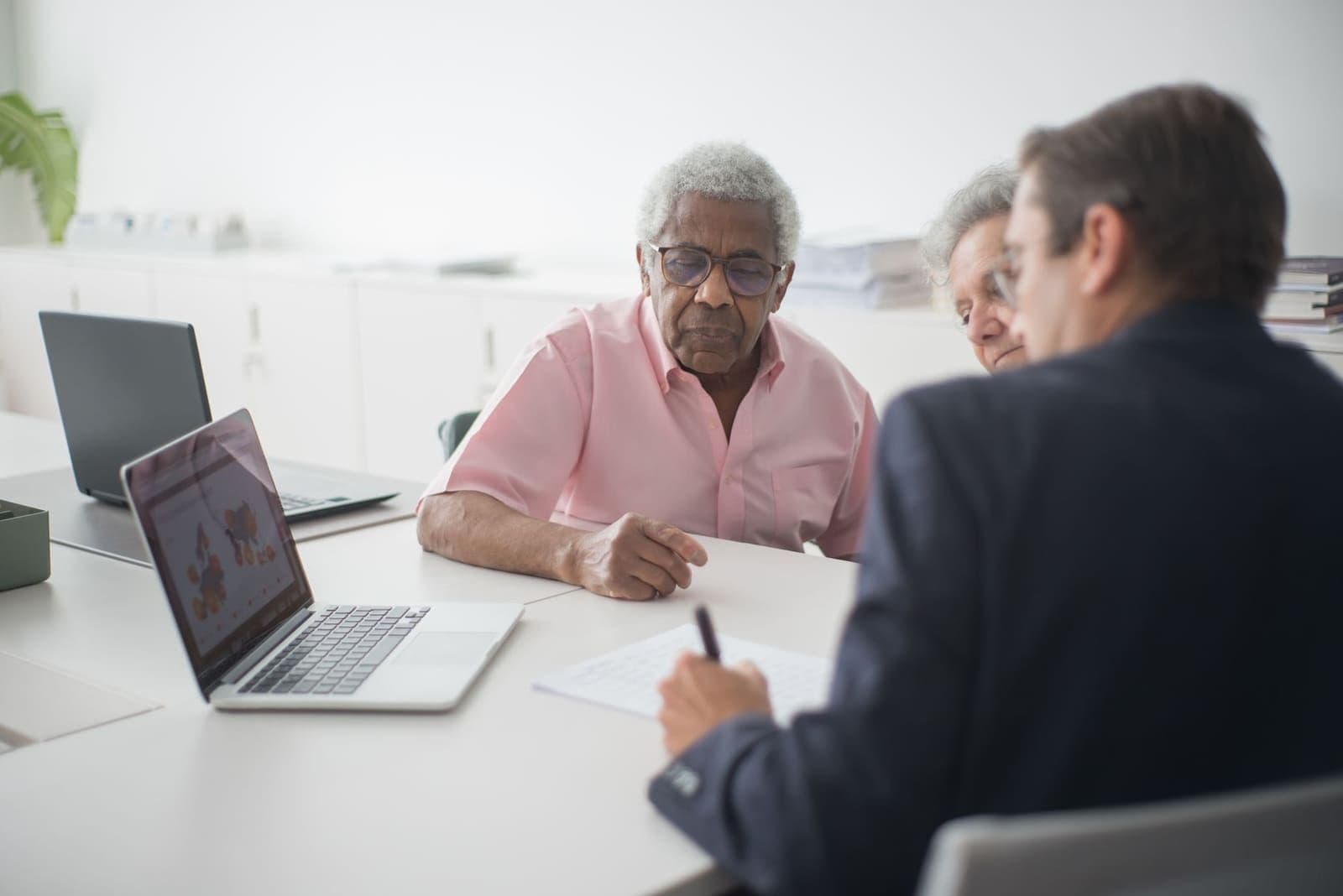 A licensed agent walking a couple through Aflac life insurance coverage