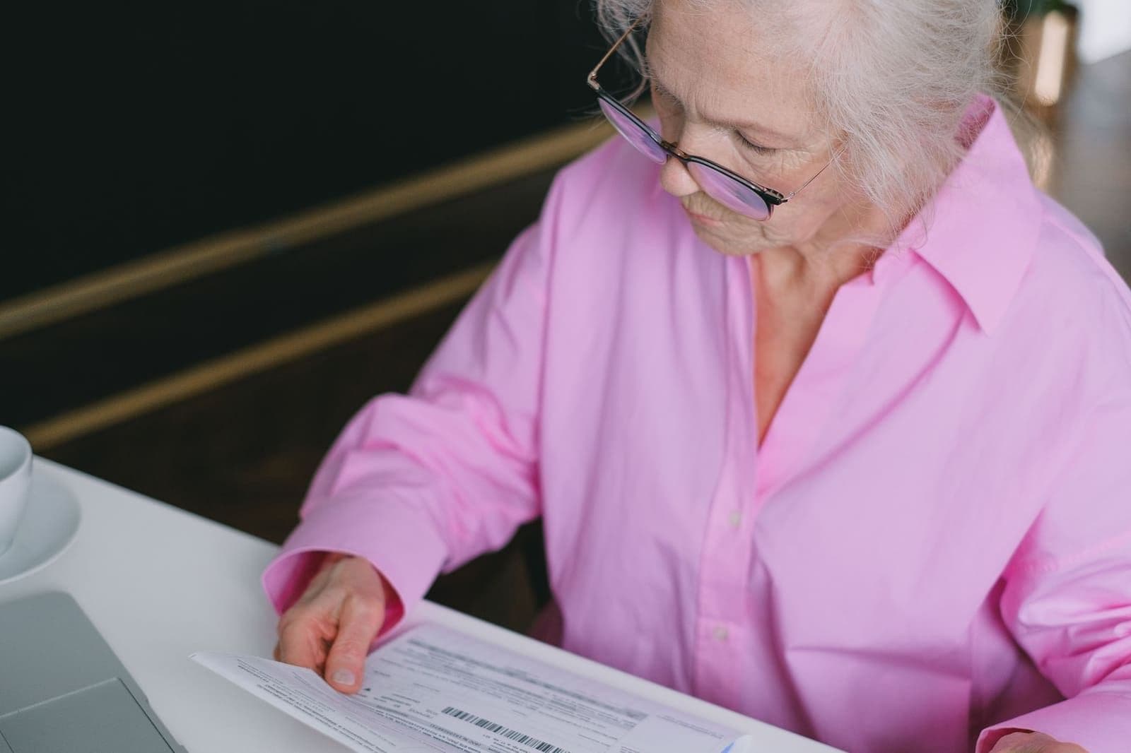 A woman comparing Genworth life insurance plan details at home