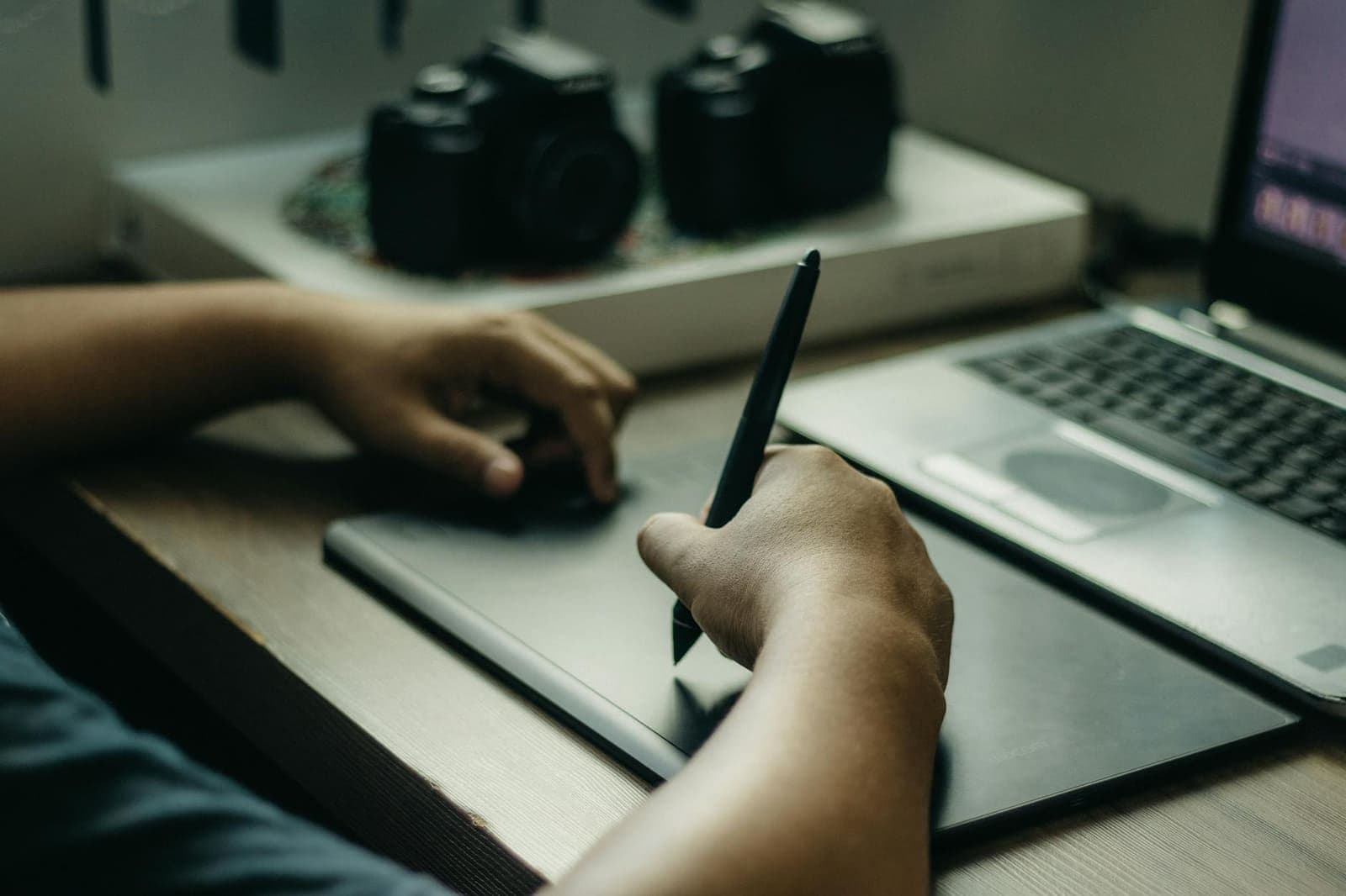 Two life insurance illustrations side by side on a desk, compared line by line