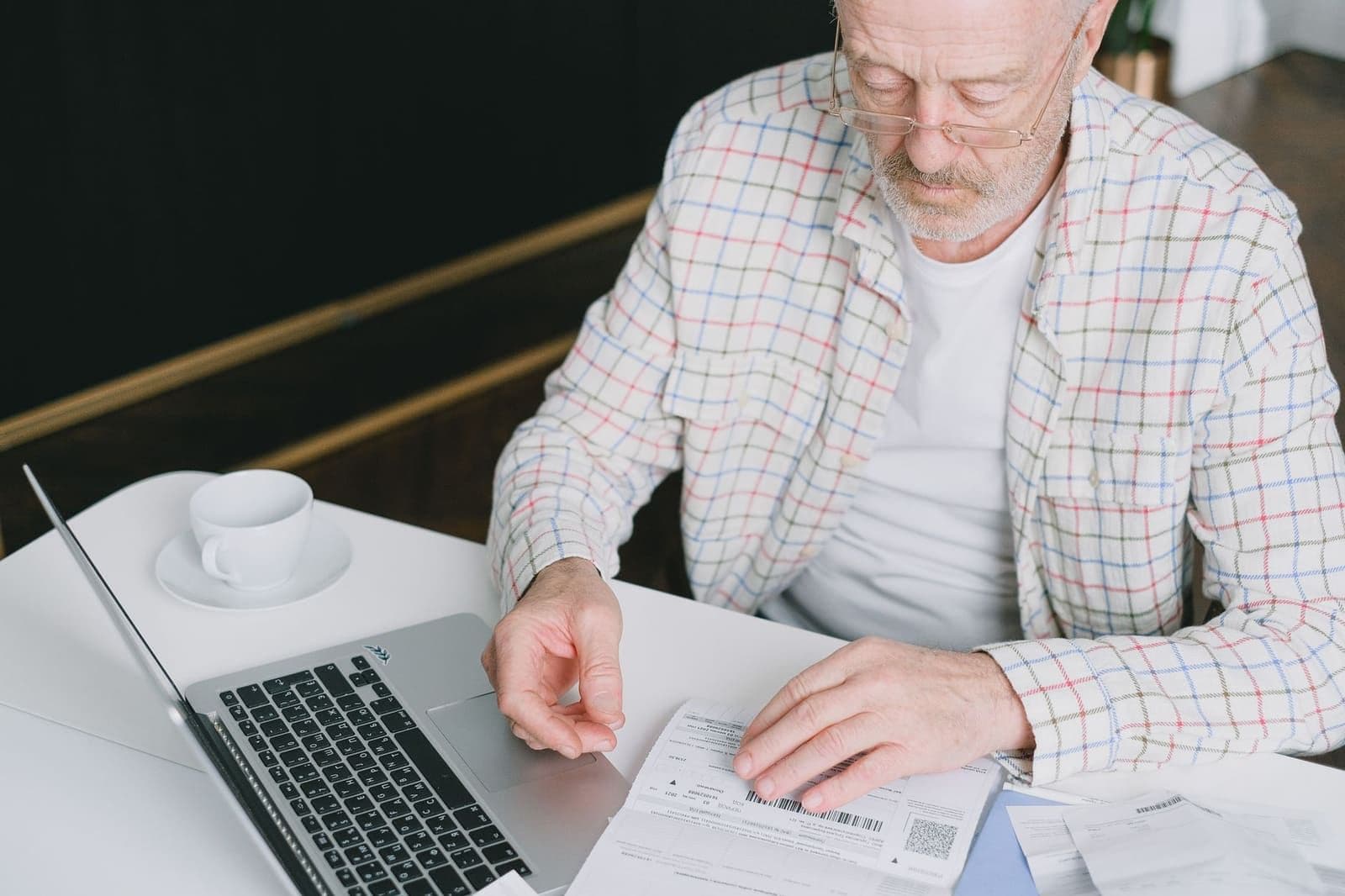 A retiree checking his Assurity life insurance rate at home