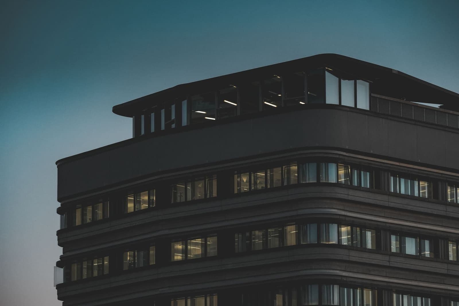 A Des Moines office building at dusk, evoking Principal’s Iowa headquarters