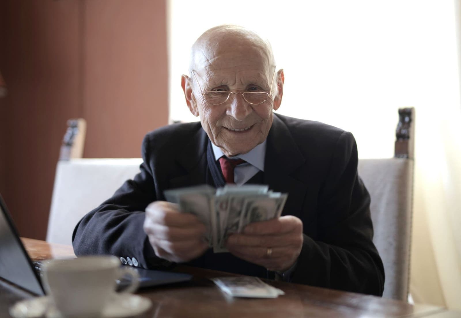 A retiree checking his TruStage life insurance rate at home