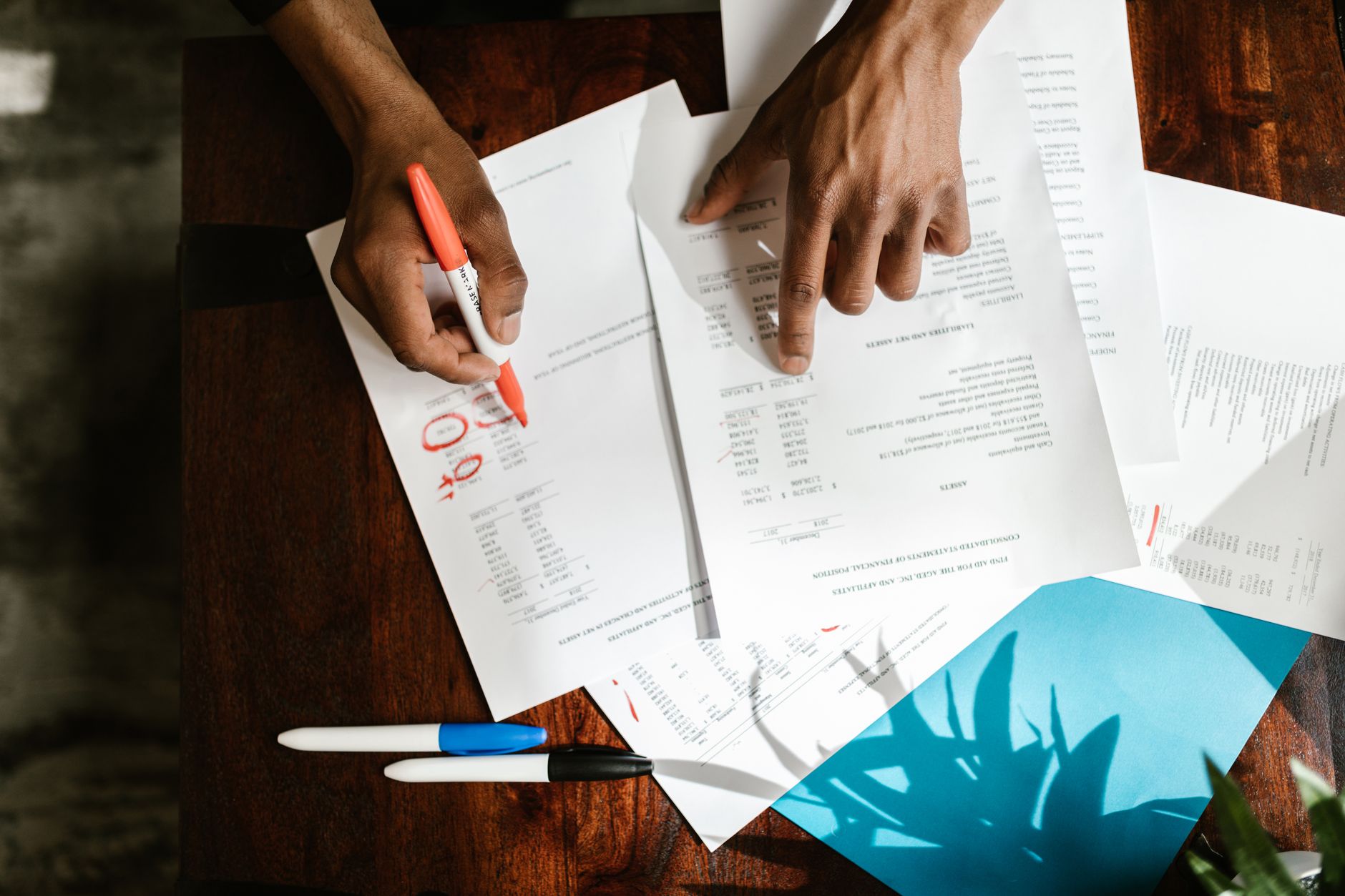 A person reviewing a policy illustration line by line at a desk