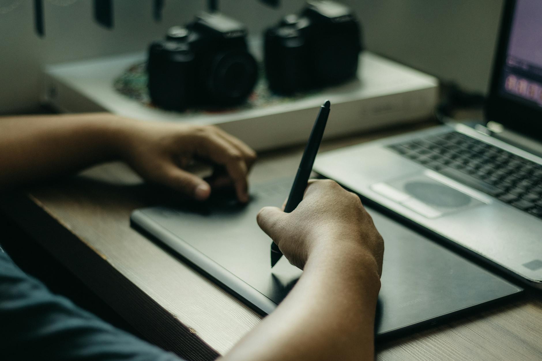 Two life insurance illustrations side by side on a desk, compared line by line