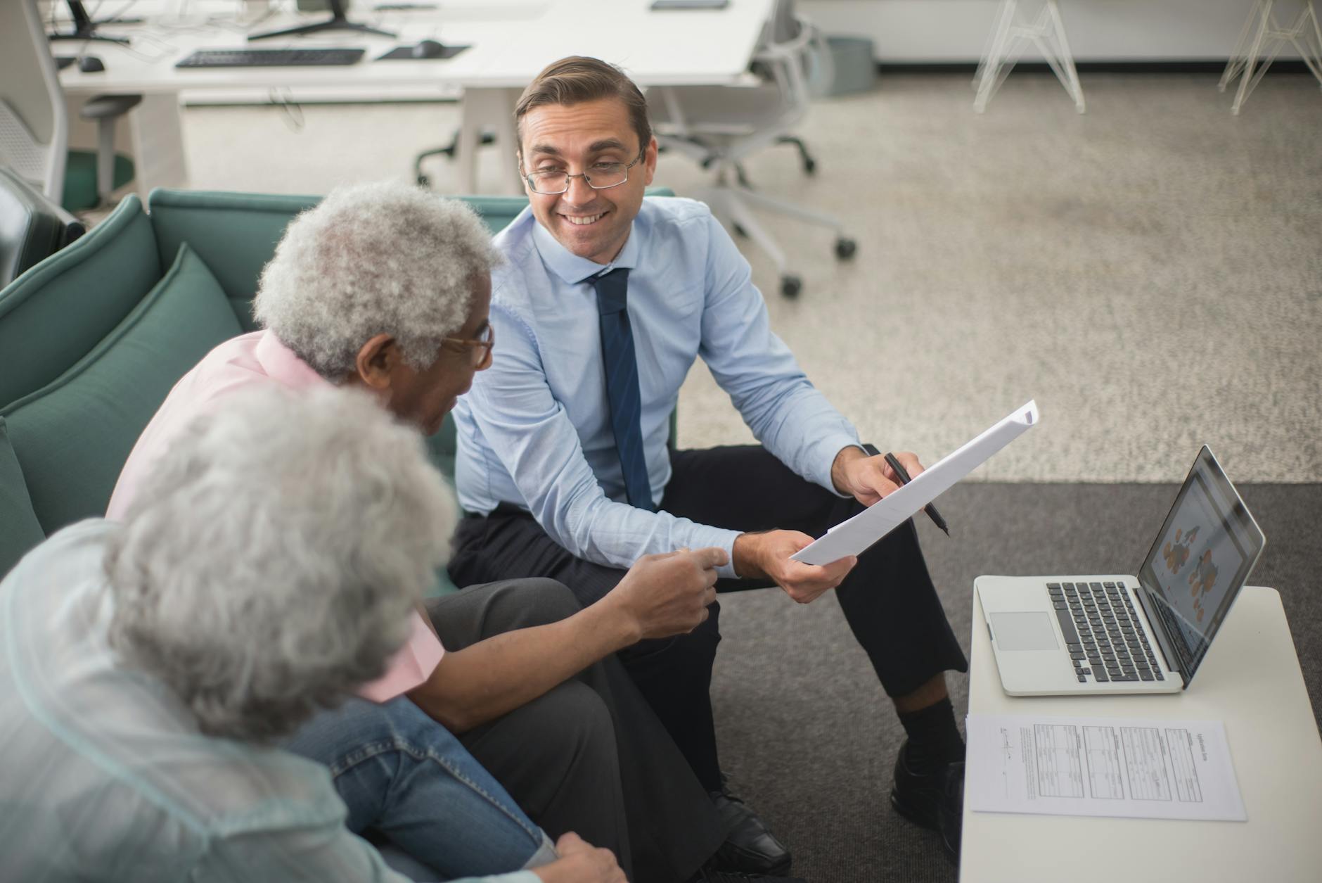 An older couple reviewing an Aetna senior products final expense insurance plan at their kitchen table