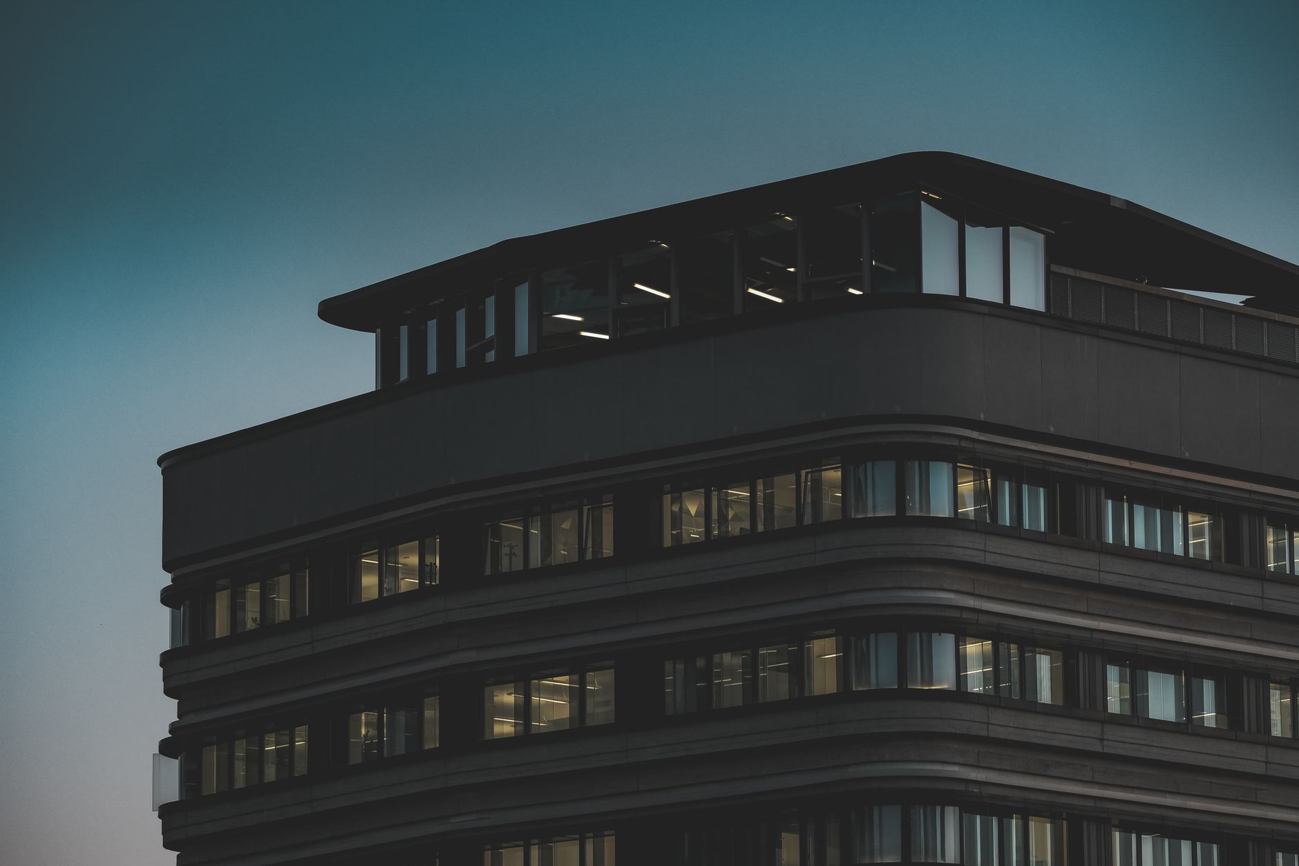 A Des Moines office building at dusk, evoking Principal’s Iowa headquarters
