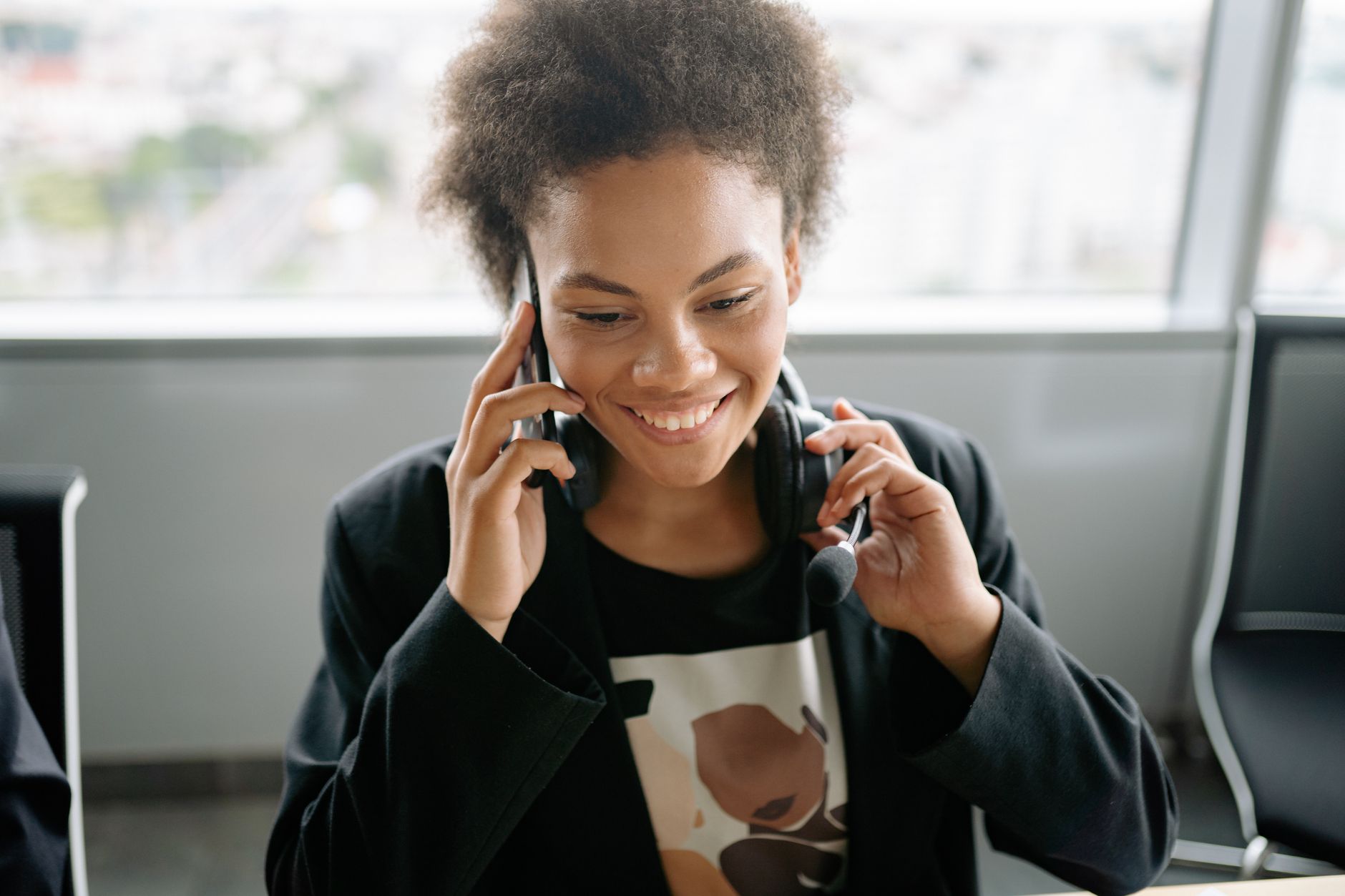 A licensed professional helping a policyholder by phone